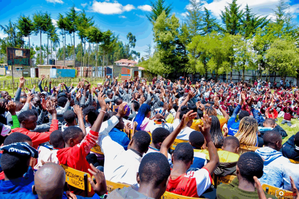 Students in Kinangop, Kenya excitedly wait for books from the Friends of the Joliet Public Library.