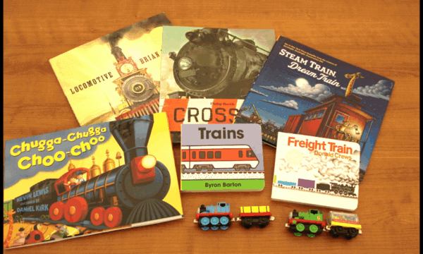 photo of train books and toy trains that would be featured in a train kit.